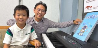 8-Year-Old Pianist Puts on Monthly Concerts at Juanita Pohl Center Andrew Gong and his father Patrick Gong both pose by the piano after Andrew Gong’s performance at the Juanita Pohl Center.