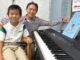8-Year-Old Pianist Puts on Monthly Concerts at Juanita Pohl Center Andrew Gong and his father Patrick Gong both pose by the piano after Andrew Gong’s performance at the Juanita Pohl Center.