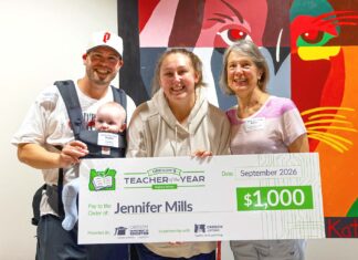 Tualatin High educator named Regional Teacher of the Year Regional Teacher of the Year Jennifer Mills (center) celebrates her $1,000 prize alongside her husband, Garrett, and son, Cal (left), and her mom, Juliann Williams, (right). Mills, an educator at Tualatin High School, advances to compete for the Oregon Teacher of the Year honor later this fall.