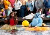 Giant Pumpkins Set Sail at Tualatin’s West Coast Giant Pumpkin Regatta Two participants in their giant pumpkins.
