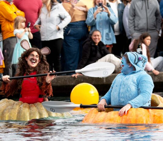 Giant Pumpkins Set Sail at Tualatin’s West Coast Giant Pumpkin Regatta Two participants in their giant pumpkins.