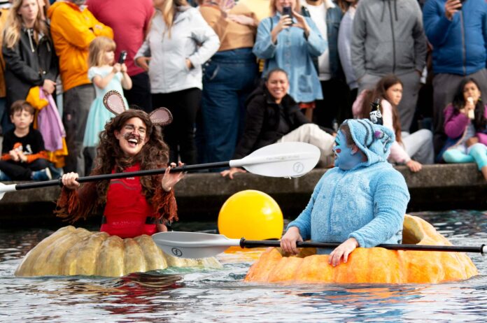 Regatta-featured Two participants in their giant pumpkins.