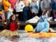 Giant Pumpkins Set Sail at Tualatin’s West Coast Giant Pumpkin Regatta Two participants in their giant pumpkins.