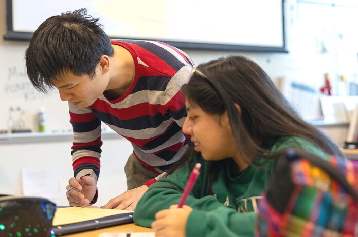 Students-Learning The Tigard-Tualatin School District has begun implementing changes to technology used in the classroom. Current initiatives include banning Youtube for middle schoolers and erasing the incentivization of devices in the classroom.