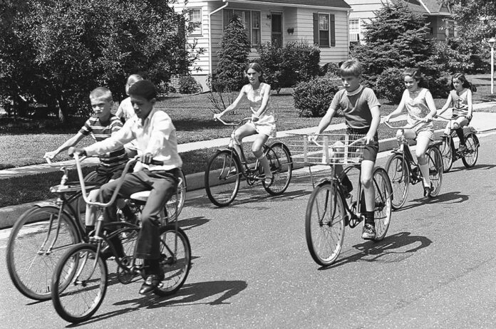 kids-on-bikes A black and white photo of kids riding bikes.