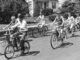 The Kids These Days A black and white photo of kids riding bikes.
